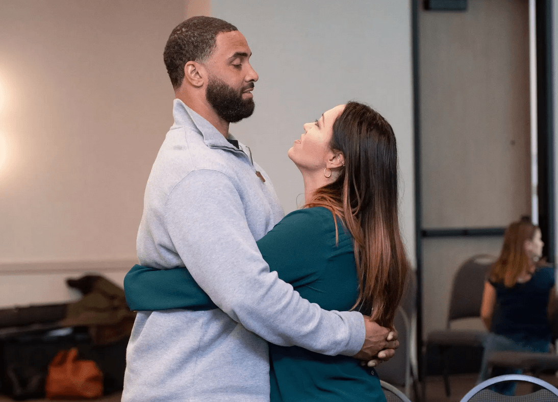 Couple participating in an online coaching session with Love Recon from the comfort of their home