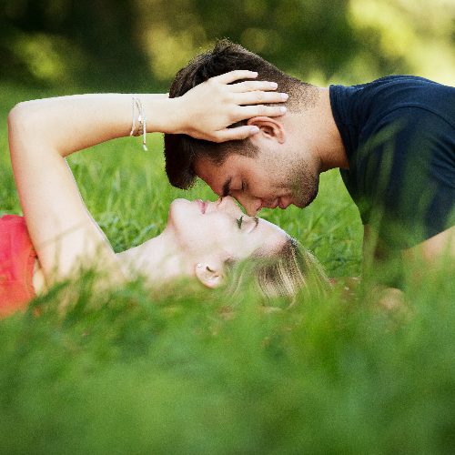 couple-lying-on-grass