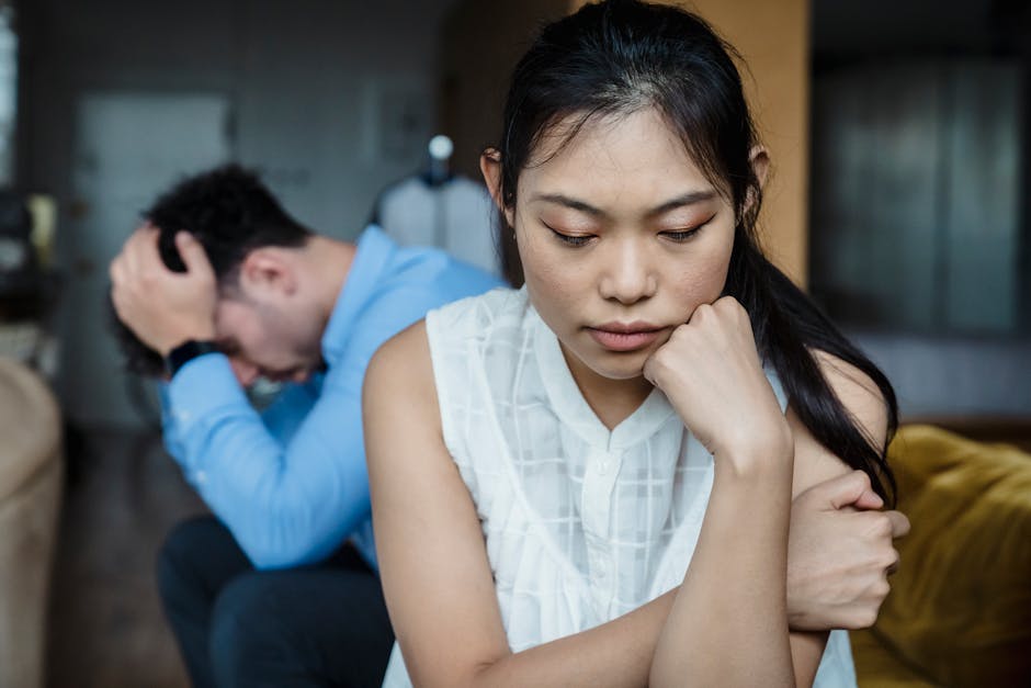 despondent asian couple